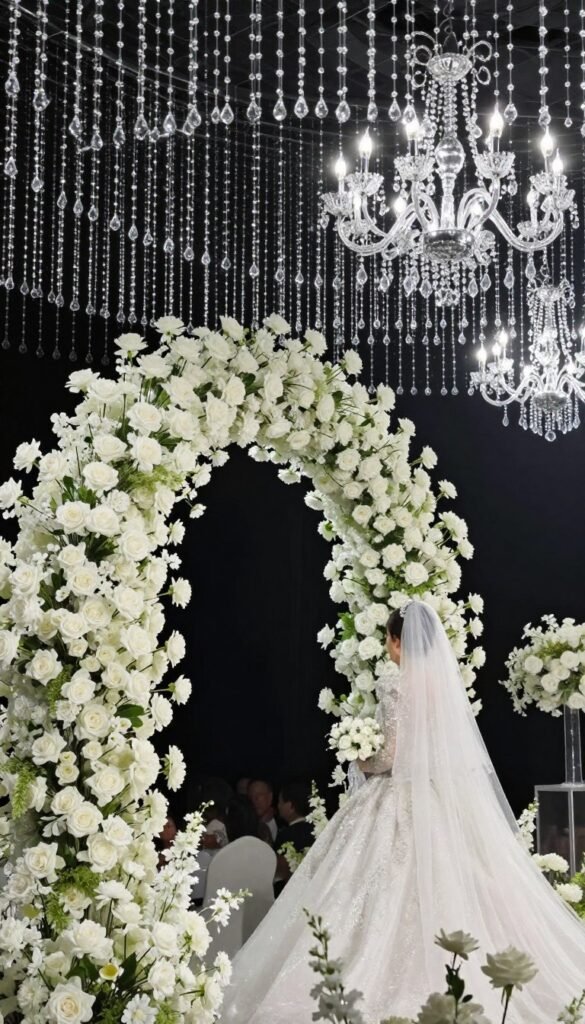 Glamorous wedding arch with hanging crystal accents for luxury romantic ceremonies Glamorous wedding arch with hanging crystal accents for luxury romantic ceremonies